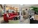 Open living room with red couch and kitchen view at 1928 9Th St, Sarasota, FL 34236