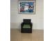 Common area with a wicker chair and framed artwork at 1928 9Th St, Sarasota, FL 34236