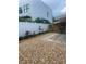 Stone pathway and minimal landscaping in the backyard at 1928 9Th St, Sarasota, FL 34236