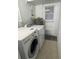Laundry room with washer, dryer, and exterior access at 1928 9Th St, Sarasota, FL 34236