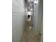 Long hallway with light-colored walls and terrazzo flooring at 1928 9Th St, Sarasota, FL 34236