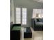 Cozy living room with wicker furniture and glass-top coffee table at 1928 9Th St, Sarasota, FL 34236