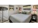 Cozy bedroom with a queen bed and window at 1928 9Th St, Sarasota, FL 34236
