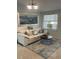 Living room featuring a light beige couch and a unique coffee table at 1928 9Th St, Sarasota, FL 34236