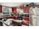Island kitchen with dark wood cabinets and granite countertops at 1928 9Th St, Sarasota, FL 34236