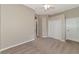 Bright bedroom featuring a double door closet and carpet flooring at 259 Dahlia Ct, Bradenton, FL 34212