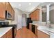 Kitchen with stainless steel appliances and light wood cabinets at 259 Dahlia Ct, Bradenton, FL 34212