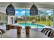 Relaxing pool area with covered patio and outdoor seating at 158 Allworthy St, Port Charlotte, FL 33954