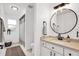 Modern bathroom with updated vanity, large mirror, and shower at 158 Allworthy St, Port Charlotte, FL 33954
