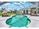 Inviting kidney-shaped pool with screened enclosure at 158 Allworthy St, Port Charlotte, FL 33954