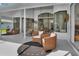 Relaxing patio with wicker furniture and view of the house at 158 Allworthy St, Port Charlotte, FL 33954