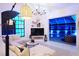 L-shaped sectional sofa and a large TV in a living room at 158 Allworthy St, Port Charlotte, FL 33954