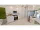 Modern kitchen with stainless steel appliances and white cabinetry at 18770 Mcgrath Cir, Port Charlotte, FL 33948