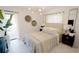 Bedroom with a comfortable bed, nightstands, and access to a patio at 18770 Mcgrath Cir, Port Charlotte, FL 33948