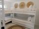 Bedroom with a built in L-shaped bunk bed, providing ample sleeping space at 18770 Mcgrath Cir, Port Charlotte, FL 33948