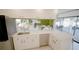 Modern kitchen with stainless steel appliances and white cabinetry at 18770 Mcgrath Cir, Port Charlotte, FL 33948