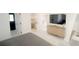 Spacious bedroom with large TV, ample closet space, and light flooring at 18770 Mcgrath Cir, Port Charlotte, FL 33948