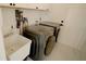 Convenient laundry room with washer, dryer, and a utility sink at 18770 Mcgrath Cir, Port Charlotte, FL 33948