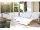 White lounge chairs by the pool, perfect for relaxation at 11061 Sandrift Ave, Englewood, FL 34224