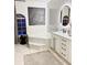 Bathroom featuring a large soaking tub and modern vanity at 11061 Sandrift Ave, Englewood, FL 34224