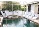 Inviting pool area with spa and lounge chairs; perfect for relaxation at 11061 Sandrift Ave, Englewood, FL 34224