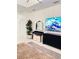 Bright bedroom with a large TV and stylish dresser at 11061 Sandrift Ave, Englewood, FL 34224