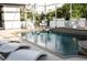 Inviting pool with plenty of lounge chairs for sunbathing at 11061 Sandrift Ave, Englewood, FL 34224