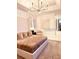 Bright and airy main bedroom with a large bed and stylish furnishings at 11061 Sandrift Ave, Englewood, FL 34224