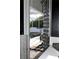 View of the pool from the bathroom, with access through sliding door at 11061 Sandrift Ave, Englewood, FL 34224
