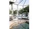 Pool area with lounge chair and view of the surrounding landscape at 11061 Sandrift Ave, Englewood, FL 34224