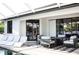 Outdoor patio with seating and fire pit, ideal for entertaining at 11061 Sandrift Ave, Englewood, FL 34224
