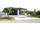 Spacious driveway leading to a modern home with a two-car garage at 11061 Sandrift Ave, Englewood, FL 34224