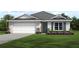 One-story home with a two-car garage and landscaped yard at 4911 Hillman Ter, North Port, FL 34288