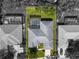 Aerial view of a home with a pool, surrounded by trees and other homes at 1206 86Th Nw Ct, Bradenton, FL 34209