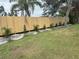 Brand new backyard fence enhances privacy, complemented by newly planted shrubbery along the border of the property at 1206 86Th Nw Ct, Bradenton, FL 34209