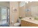 Guest bathroom with single vanity, toilet, and step-in shower at 1206 86Th Nw Ct, Bradenton, FL 34209