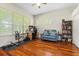 Home office features a desk, couch, stationary bike, and plenty of storage at 1206 86Th Nw Ct, Bradenton, FL 34209