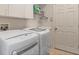 Laundry room with washer, dryer, and utility sink at 1206 86Th Nw Ct, Bradenton, FL 34209