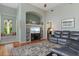 Inviting living room with a large flat-screen TV, ample built-in shelving, hardwood floors, and lots of natural light at 1206 86Th Nw Ct, Bradenton, FL 34209