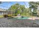 Screened-in pool and spa with a paved deck and lush landscaping at 1206 86Th Nw Ct, Bradenton, FL 34209