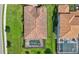 Aerial view of the home showcasing the tile roof, landscaping, and adjacent property at 13108 Swiftwater Way, Bradenton, FL 34211