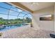 Relaxing screened-in lanai with a pool overlooking a serene lake view at 13108 Swiftwater Way, Bradenton, FL 34211