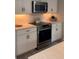 Modern kitchen features stainless steel appliances and white shaker cabinets at 5228 Bentgrass Way, Bradenton, FL 34211