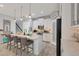 Bright kitchen with white cabinets, island, and stainless steel appliances at 5228 Bentgrass Way, Bradenton, FL 34211