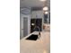 Kitchen features a large island with a black farmhouse sink and modern faucet at 5228 Bentgrass Way, Bradenton, FL 34211