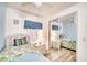 Cozy bedroom with twin bed, mirrored closet, and relaxing coastal decor at 6428 Fleetwood Ct, North Port, FL 34287