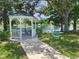 Enjoy the community gazebo by the lake with seating and beautiful views of the surrounding landscape at 6428 Fleetwood Ct, North Port, FL 34287