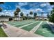 Community shuffleboard courts with seating for friendly competition at 6428 Fleetwood Ct, North Port, FL 34287