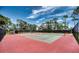 Outdoor community tennis courts featuring well-maintained landscaping and plenty of trees at 6428 Fleetwood Ct, North Port, FL 34287