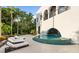 Curved pool with lounge chairs and lush greenery at 3482 Flamingo Ave, Sarasota, FL 34242